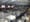 Lines of people of snake around Moynihan Train Hall in an aerial view of the station.