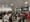 A huge crowd of people line up to purchase MetroCards in order to exit the AirTrain at the Jamaica subway stop.