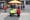 A vendor cart with a sign that says "We are workers" at Corona Plaza.