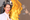 RHONY cast member Jenna Lyons, in wire-rimmed glasses and red lipstick, on the left, and Adlan Jackson on the right, with a w